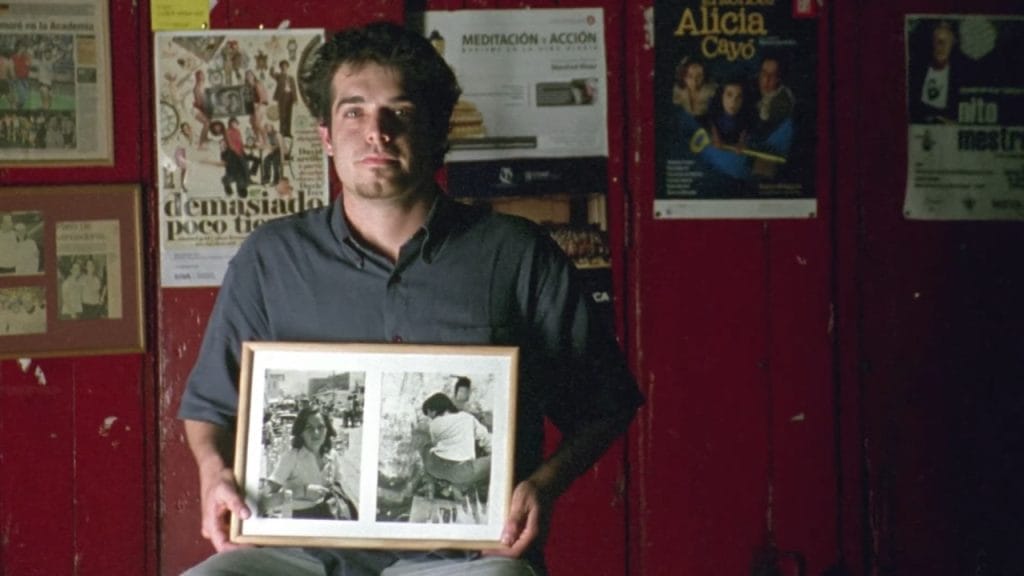 If you wanna learn Spanish with music, listen to "Latinoamérica" by calle 13. This is one of the scenes from the video, highlighting the relative of a "desaparecido".