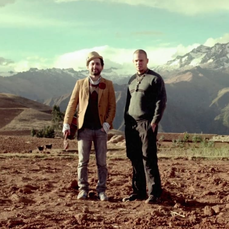 Want to learn Spanish with music? Try this song: "Latinoamérica" by Calle 13, pictured in this still from the music video.